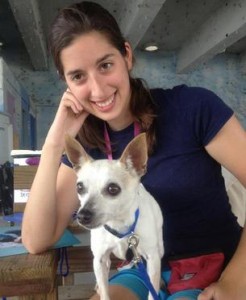 Dog Trainer Leila with white dog on lap